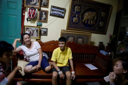 Duangpet Promtep and his aunt, whom he calls mother, Thanaporn Promthep smile during an interview at their home, in Mae Sai, the northern province of Chiang Rai, Thailand, July 19, 2018. REUTERS/Soe Zeya Tun