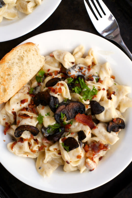 <p>The Two Bite Club</p><p>Need to cobble together a romantic dinner at a moment's notice? This creamy Parmesan tortellini is your answer. </p><p><strong>Get the recipe: <a href="https://www.thetwobiteclub.com/2015/09/parmesan-tortellini-with-mushrooms-and.html" rel="nofollow noopener" target="_blank" data-ylk="slk:Parmesan Tortellini With Mushrooms and Bacon;elm:context_link;itc:0;sec:content-canvas" class="link ">Parmesan Tortellini With Mushrooms and Bacon</a></strong></p>