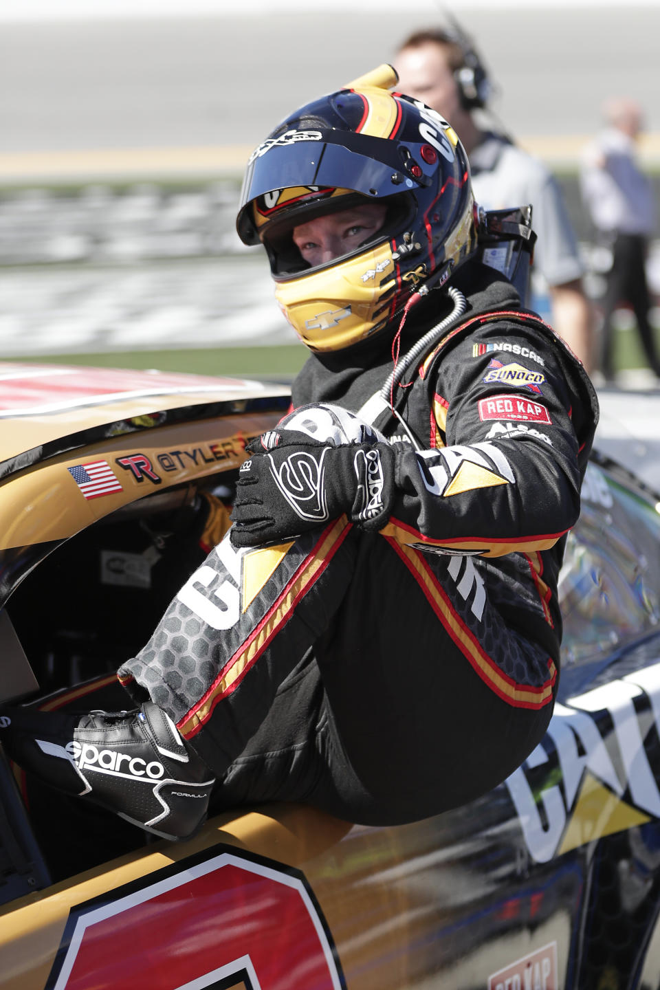 Tyler Reddick climbs out of his car after his run at NASCAR auto race qualifying at Daytona International Speedway, Sunday, Feb. 9, 2020, in Daytona Beach, Fla. (AP Photo/John Raoux)