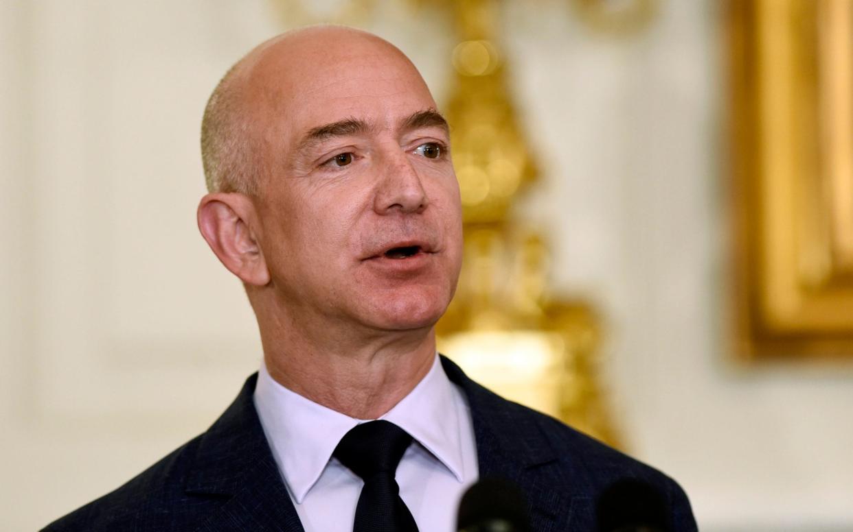 Jeff Bezos has decided to open two satellite offices rather than the proposed 'HQ2' location - AP