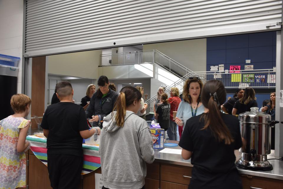 Special education and general education students work together to serve teachers at Mill Creek Middle School's Maverick Café on its last day of the school year on May 20, 2022 in Nolensville, Tenn.