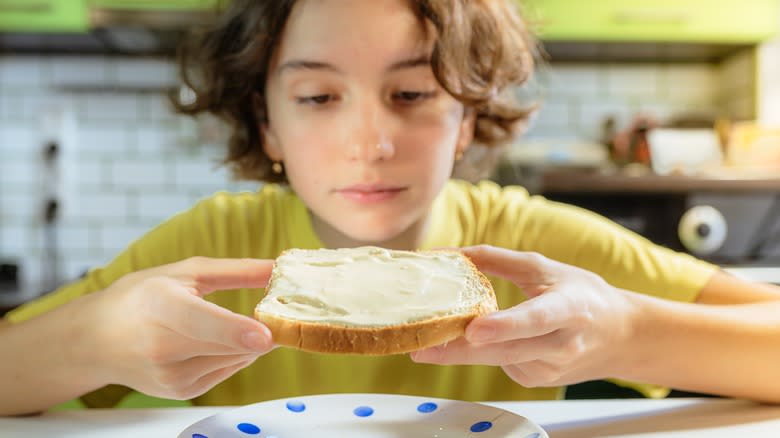 person holding sandwich bread