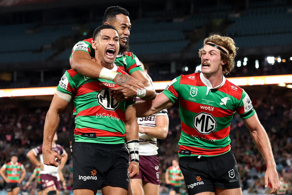 Cody Walker celebrates with his Rabbitohs teammates.