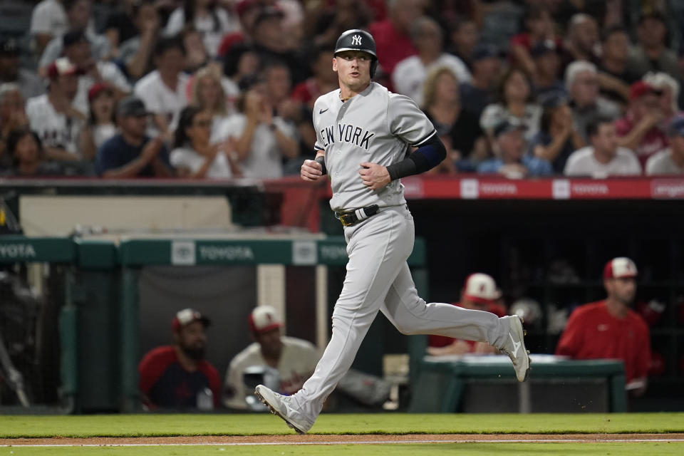 New York Yankees' Josh Donaldson scores on a double by Gleyber Torres during the fifth inning of a baseball game against the Los Angeles Angels in Anaheim, Calif., Wednesday, Aug. 31, 2022. (AP Photo/Ashley Landis)