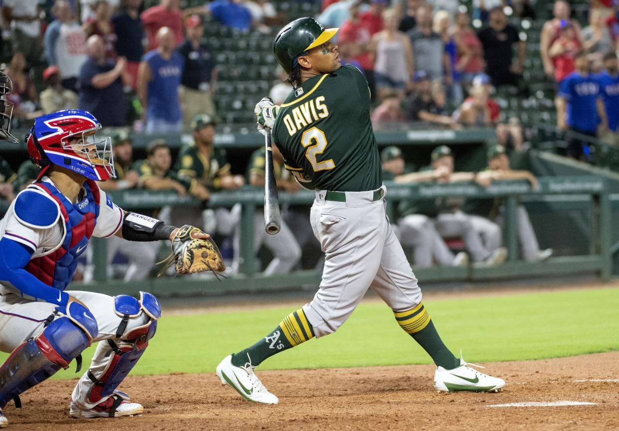 Khris Davis wore the autograph of one of his biggest fans as he mashed his 37th home run of the season against the Rangers. (AP)