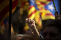 <p>A pro Independence demonstrator gestures as Catalan mayors under investigation take part in a march, outside the Generalitat Palace, to protest against the ruling of the constitutional court ahead of a planned independence referendum in the Catalonia region, in Barcelona, Spain, Saturday, Sept. 16, 2017. (Photo: Emilio Morenatti/AP) </p>