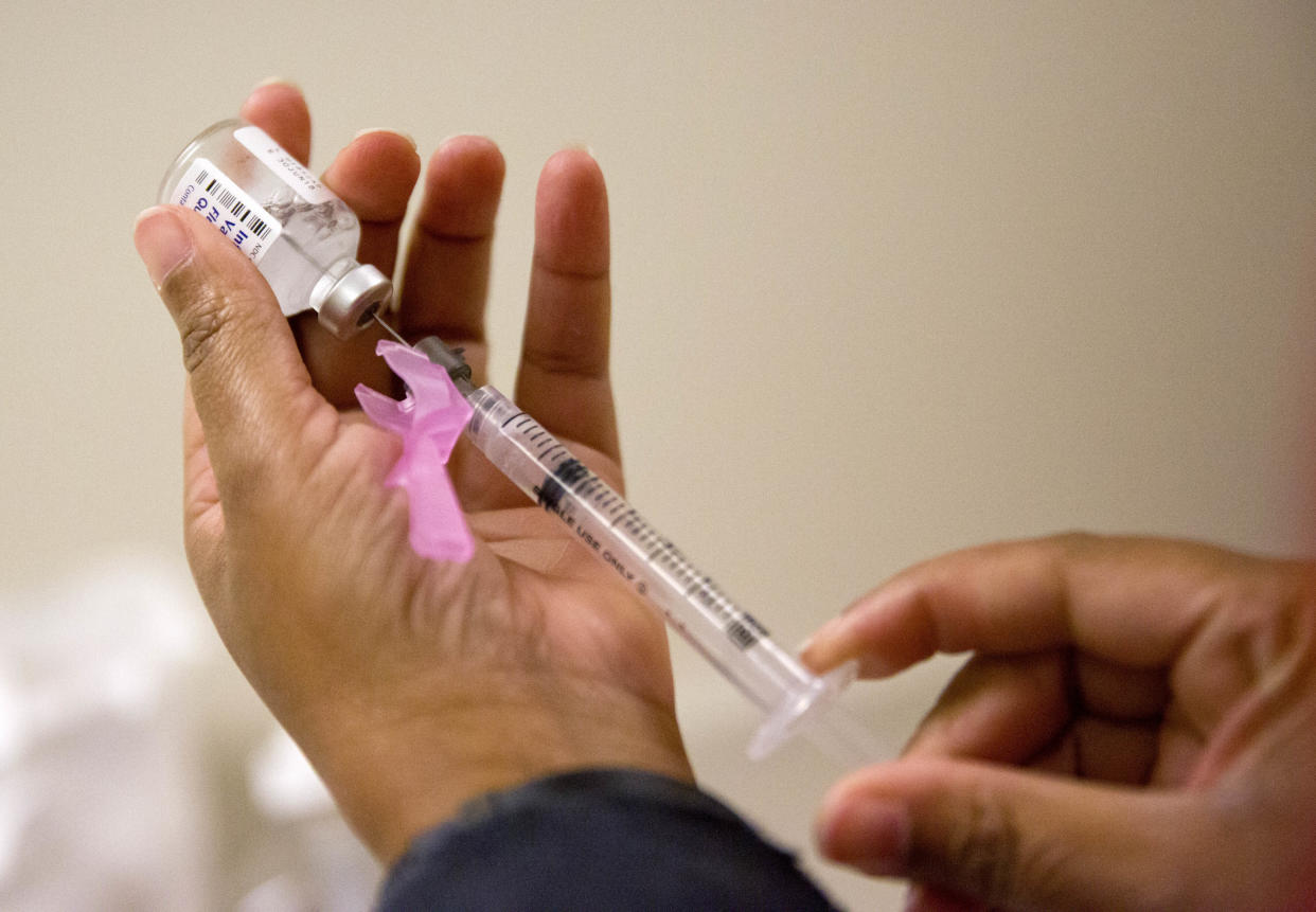 Nurse Nicole Simpson prepares a flu shot at the Salvation Army in Atlanta, Wednesday, Feb. 7, 2018. The U.S. government's latest flu report released on Friday, Feb. 2, 2018, showed flu season continued to intensify the previous week, with high volumes of flu-related patient traffic in 42 states, up from 39 the week before. (AP Photo/David Goldman)