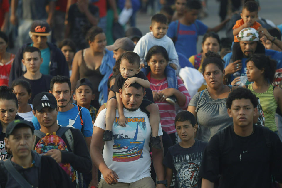 Hundreds of Central American migrants walk together on the highway, after crossing the Guatemala – Mexico border, near Ciudad Hidalgo, Mexico, Wednesday, June 5, 2019. State and local police provided a security escort to the migrants as they walked along a highway leading from the border to the first major city in Mexico, Tapachula. (AP Photo/Marco Ugarte)