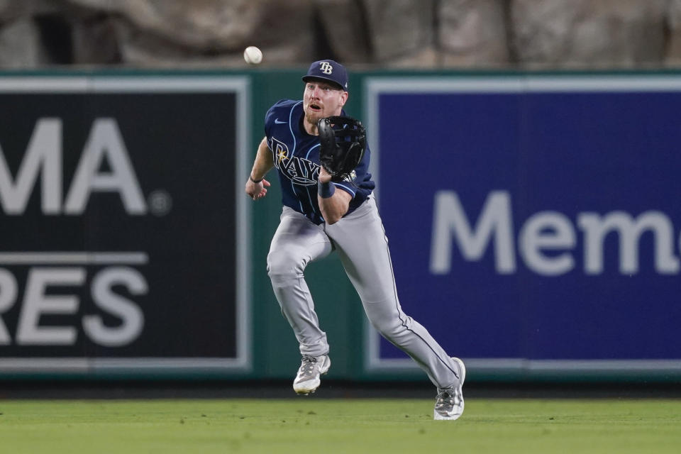 Tampa Bay Rays center fielder Luke Raley catches a line drive hit by Los Angeles Angels' Mickey Moniak in the 10th inning for the final out of a baseball game Friday, Aug. 18, 2023, in Anaheim, Calif. (AP Photo/Ryan Sun)