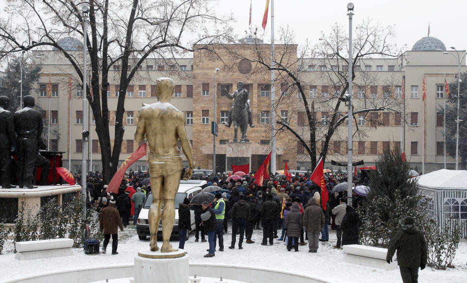 Opponents to the change of the country's constitutional name protest outside the parliament building prior to a session of the Macedonian Parliament in the capital Skopje, Wednesday, Jan. 9, 2019. Macedonian lawmakers are entering the last phase of debate on constitutional changes to rename their country North Macedonia as part of a deal with neighboring Greece to pave the way for NATO membership and eventually joining the European Union. (AP Photo/Boris Grdanoski)