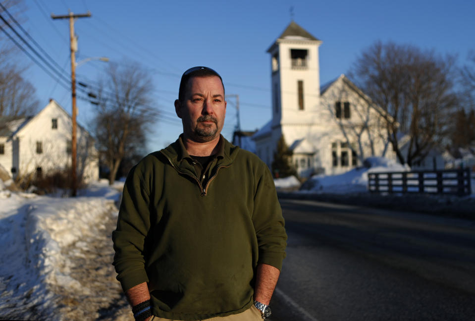 In this Tuesday, March 12, 2019 photo, former SWAT officer Al Joyce walks in Norway, Maine. Joyce left his job in law enforcement in Jefferson County, Colorado, after a school shooting and now works as a cashier. Joyce was part of the team that in 2006 stormed a classroom in Platte Canyon High School in the town of Bailey, southwest of Denver and saw the aftermath of a shooting. It wasn't long before the nightmares began and he started drinking heavily to avoid them. He ended up leaving the SWAT team, divorcing his wife and withdrawing from the world. "I wanted to just shut down, turn off," he said. "It didn't work out so well."(AP Photo/Robert F. Bukaty)