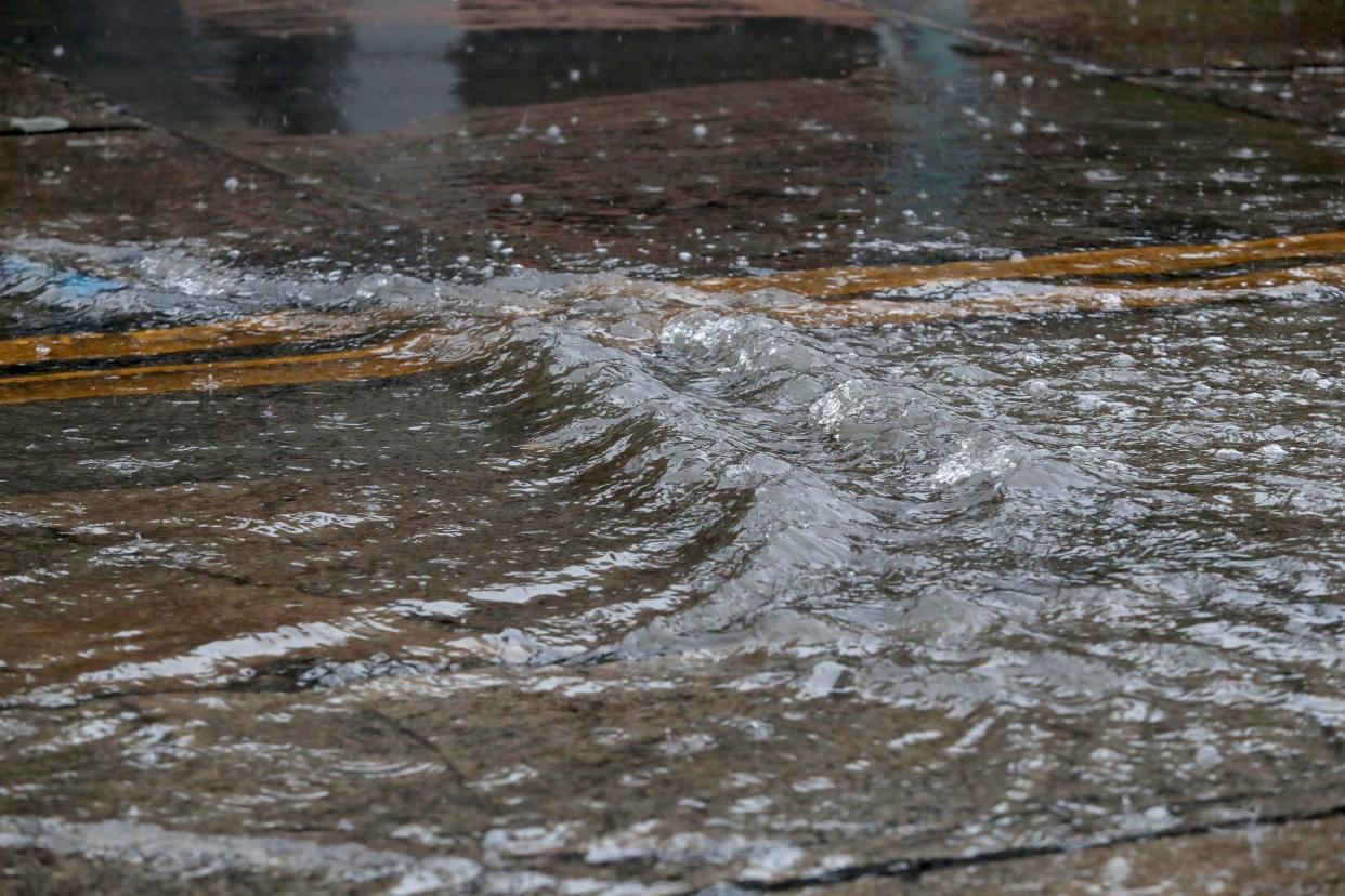 A winter storm soaks a road in Palm Springs on Monday.