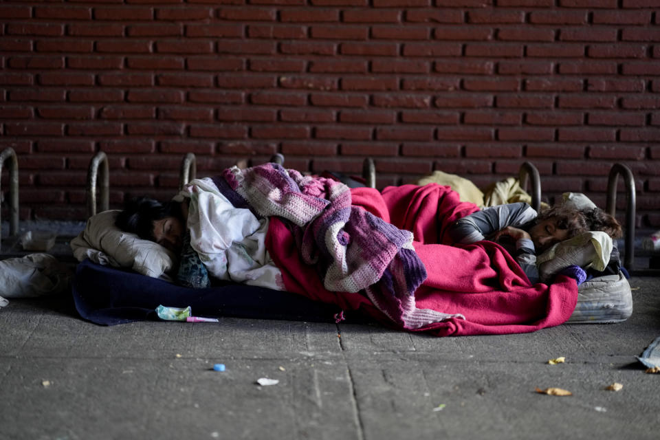 Women sleep on a street in Buenos Aires, Argentina, Thursday, May 11, 2023. According to a recent World Bank Food Security report, Argentina has seen a 107% annual inflation rate in food prices. (AP Photo/Natacha Pisarenko)