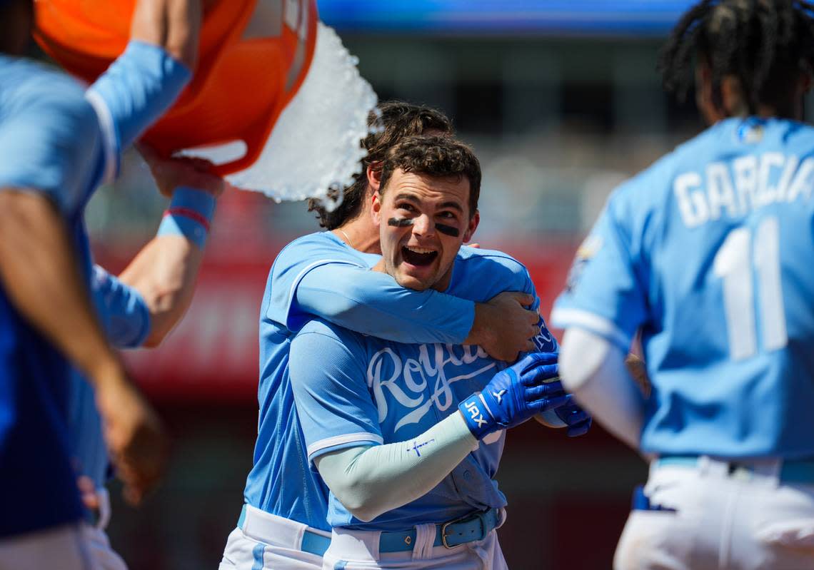 Teammates give Royals second baseman Michael Massey an ice-water bath in celebration of his walkoff single to right field on Sunday afternoon against the Washington Nationals at Kauffman Stadium.