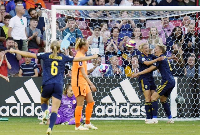 Jonna Andersson, second right, celebrates her opener with Lina Hurtig