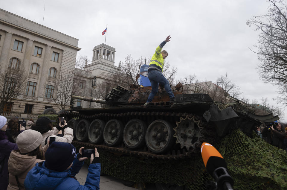 CORRECTS DATE===The wreck of a Russian T-72 tank destroyed on the approach to Kyiv is placed in front of the Russian Embassy to mark the first anniversary of Russia's full-scale invasion of Ukraine, in Berlin, Germany, Friday, Feb. 24, 2023. (AP Photo/Markus Schreiber)