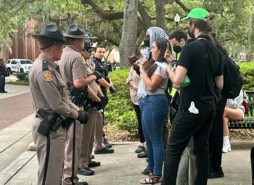 Protesters and law enforcement are shown on Monday, April 29, 2024 on the University of Florida campus.