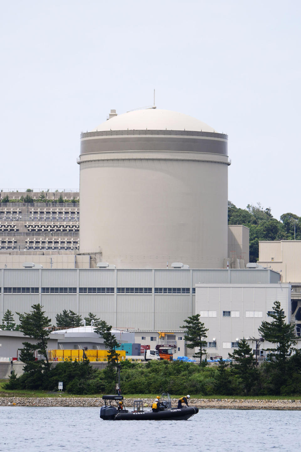 The No. 3 reactor of the Mihama Nuclear Power Plant operated by Kansai Electric Power Co. is seen in Mihama town, Fukui prefecture, central Japan, Wednesday, June 23, 2021. The more than 40-year-old nuclear reactor which suffered a deadly accident resumed operation Wednesday after being taken offline for a decade after the March 2011 Fukushima nuclear disaster, as Japan pushes to meet its carbon emissions reduction goal. (Kyodo News via AP)