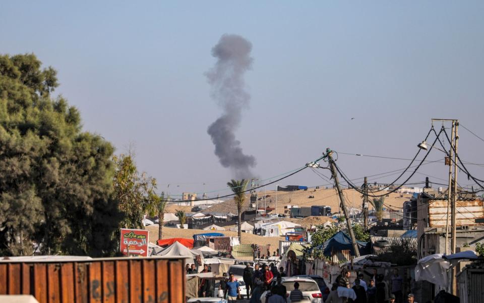 Smoke rises after an Israeli air strike in Rafah, the southernmost city in the Gaza Strip. On Monday, Israeli forces called on residents of eastern Rafah to 'temporarily' evacuate to an expanded humanitarian area.