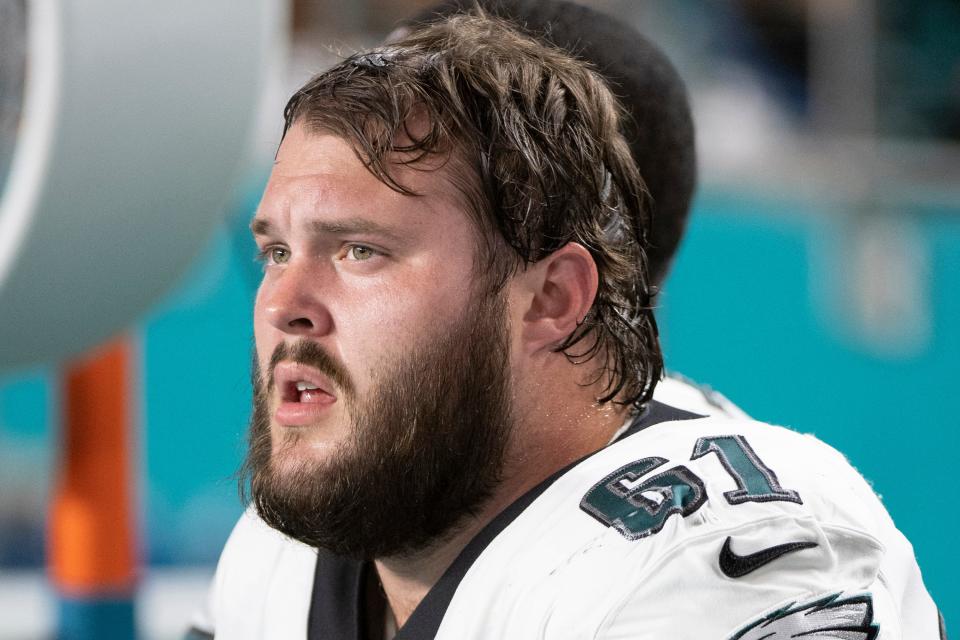 Philadelphia Eagles guard Josh Sills sits on the sidelines during a game against the Miami Dolphins on Aug. 27, 2022.