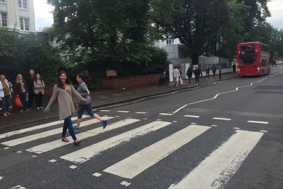 An unsympathetic jogger impedes friend Leah's interpretation of the Beatles' iconic album cover.