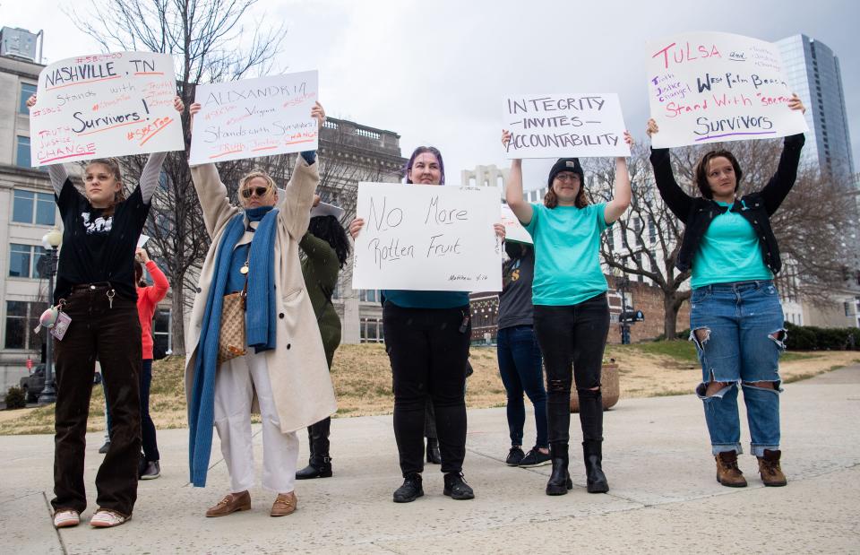 Many supporters of Hannah-Kate Williams, stands in front of the Southern Baptist Convention building in Nashville, Monday, Feb. 21, 2022, supporting survivors of sexual abuse.