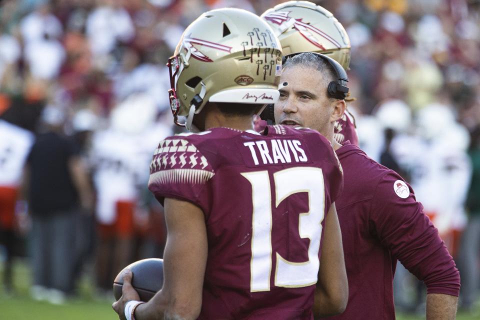 Florida State quarterback Jordan Travis (13) and head coach Mike Norvell desperately need a statement win Saturday at Clemson, which owns a seven-game winning streak against the Seminoles.