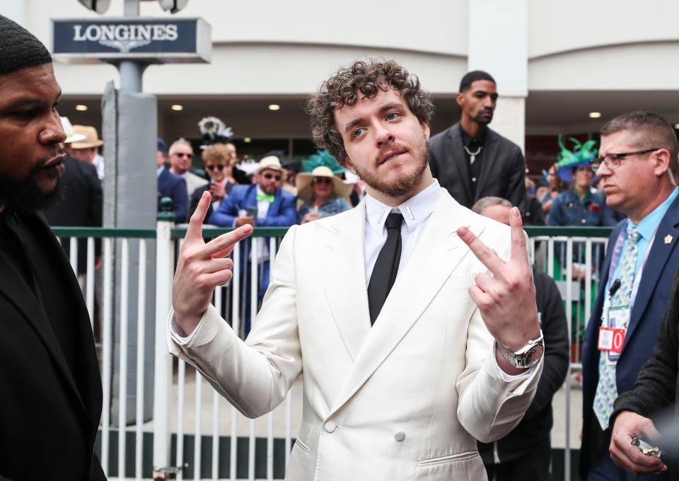 Rapper Jack Harlow of Louisville throws up a gesture while in the paddock at the 2022 Kentucky Derby.