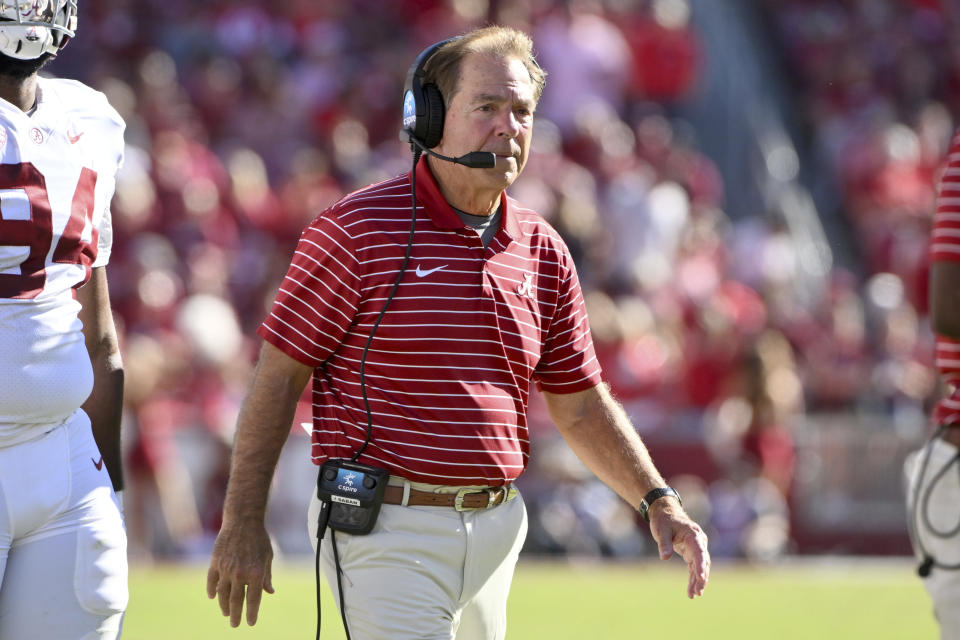 Alabama coach Nick Saban walks out to talk to his team during a time out against Arkansas during the first half of an NCAA college football game Saturday, Oct. 1, 2022, in Fayetteville, Ark. (AP Photo/Michael Woods)