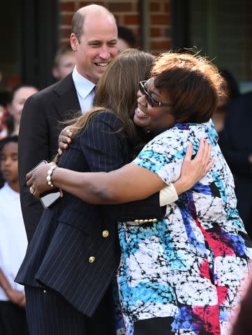 <p>Karwai Tang/WireImage</p> Kate Middleton shares a hug in Cardiff, Wales on Oct. 3