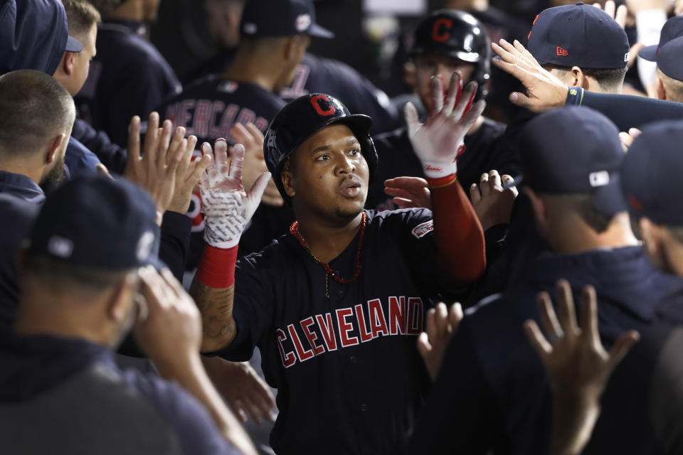 Cleveland Indians Jose Ramirez celebrates in the dugout after his three-run home run off Chicago White Sox's Hector Santiago during the third inning of a baseball game Tuesday, Sept. 24, 2019, in Chicago. (AP Photo/Charles Rex Arbogast)