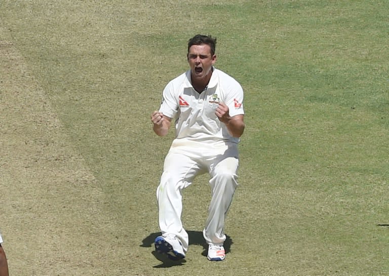 Australia's Steve O'Keefe celebrates after the dismissal of India's Ajinkya Rahane on the second day of their first Test match in Pune on February 24, 2017