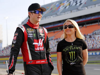 FILE - In this May 22, 2014, file photo, Kurt Busch, left, walks with Patricia Driscoll before qualifying for a NASCAR Sprint Cup series auto race at Charlotte Motor Speedway in Concord, N.C. The police investigation into allegations that NASCAR driver Kurt Busch assaulted his ex-girlfriend has been finished and forwarded to Delaware state prosecutors to decide whether charges will be filed. Cpl. Mark Hoffman with the Dover Police Department said Tuesday, Jan. 6, 2015, that the agency&#39;s investigation into the allegations was finished, but he declined to say whether investigators were recommending that Busch be charged. (AP Photo/Terry Renna)