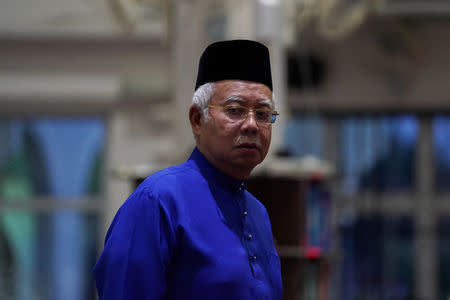 Malaysia's Prime Minister Najib Razak arrives for prayers a day before the 14th general election at a mosque in Pekan, Pahang, Malaysia, May 8, 2018. REUTERS/Athit Perawongmetha