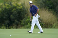 Hideki Matsuyama follows his shot on the 18th green during a practice round prior to the Tournament of Champions golf event, Wednesday, Jan. 6, 2021, at Kapalua Plantation Course in Kapalua, Hawaii. (AP Photo/Matt York)