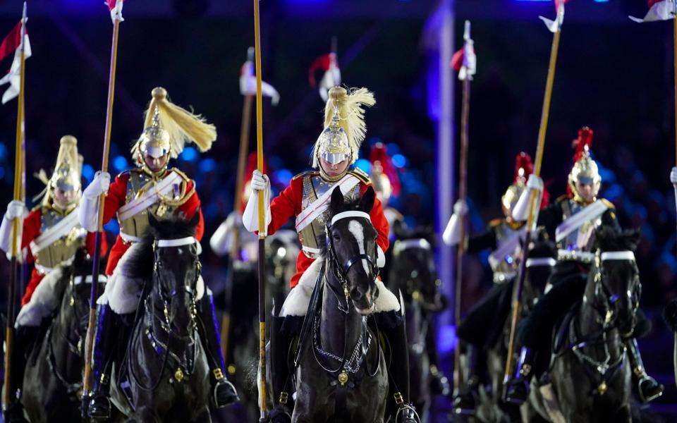The Household Cavalry Musical Ride performs during the event - Steve Parsons/PA