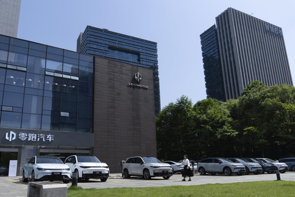 Leapmotor vehicles are parked outside a showroom in Hangzhou in eastern China's Zhejiang province on Tuesday, May 14, 2024. European carmaker Stellantis on Tuesday said it had formed a joint venture with the Chinese electric vehicle startup Leapmotor that will begin selling EVs in nine European countries later this year. (AP Photo/Caroline Chen)