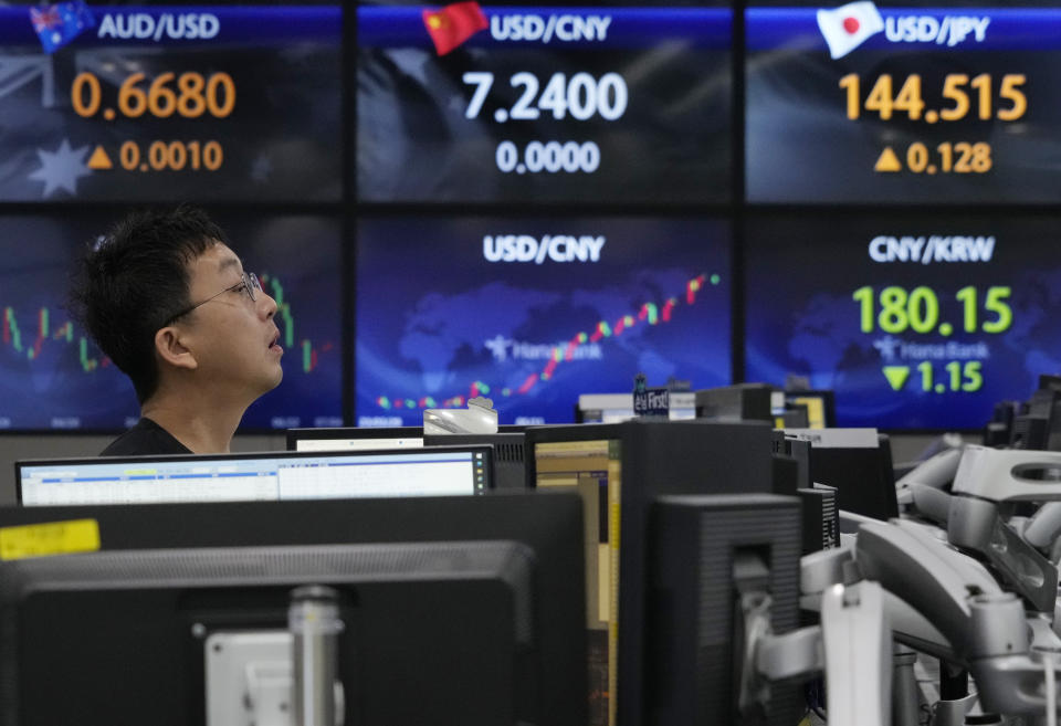 A currency trader works at the foreign exchange dealing room of the KEB Hana Bank headquarters in Seoul, South Korea, Tuesday, July 4, 2023. Asian stock markets were mixed Tuesday after Wall Street hit a 15-month high ahead of a decision by Australia's central bank on a possible interest rate hike. (AP Photo/Ahn Young-joon)