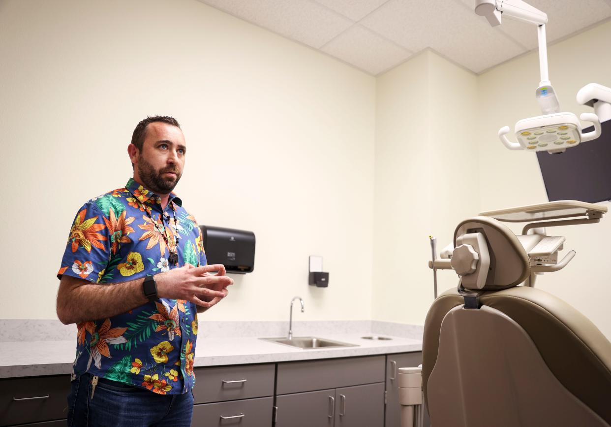 Ryan Webb, engineering and planning manager for the Confederated Tribes of Grand Ronde, stands in one of the dental exam rooms at the new public health building.