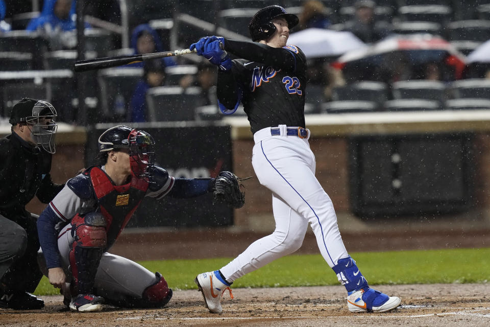 New York Mets' Brett Baty follows through on a single during the third inning of the team's baseball game against the Atlanta Braves, Friday, April 28, 2023, in New York. (AP Photo/Bryan Woolston)