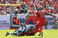 <p>Christian McCaffrey #22 of the Carolina Panthers leaps during the second quarter against the Tampa Bay Buccaneers at Raymond James Stadium on December 02, 2018 in Tampa, Florida. (Photo by Mike Ehrmann/Getty Images) </p>