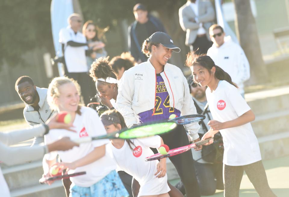 Naomi Osaka participates in Play Academy program activities with a group of kids at First Break Academy Carson, California.