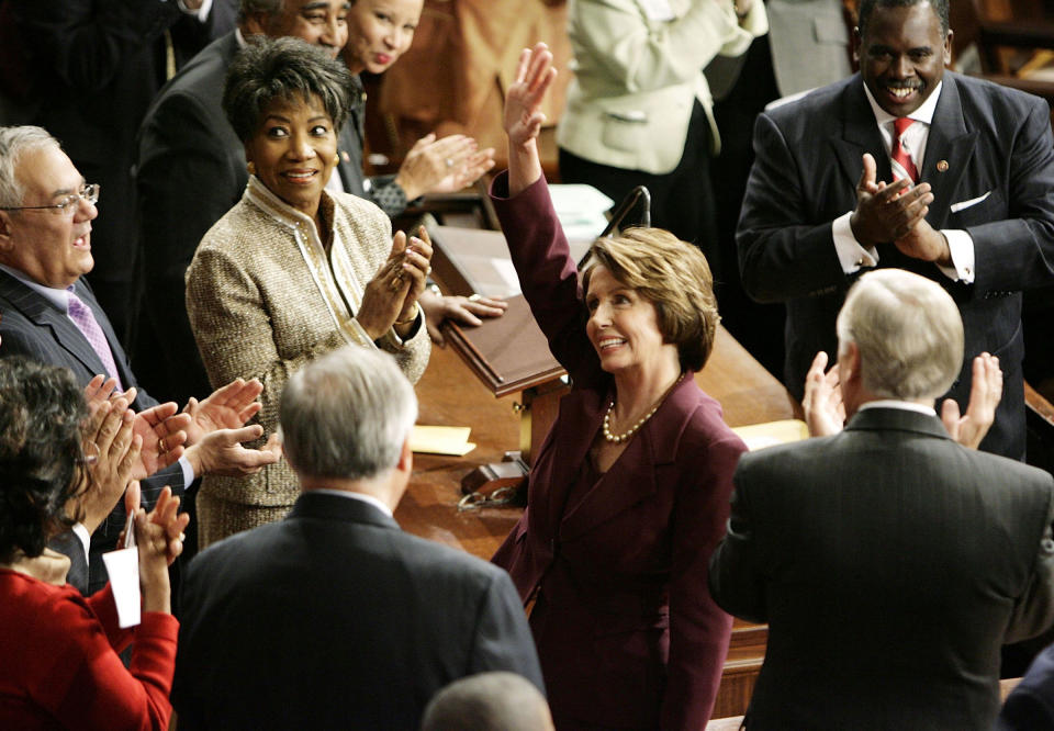 Nancy Pelosi waves to colleagues while being nominated as the next Speaker of the House during a swearing in ceremony for the 110th Congress in the House Chamber of the U.S. Capitol in Washington, DC., on Jan. 4, 2007.<span class="copyright">Chip Somodevilla—Getty Images</span>