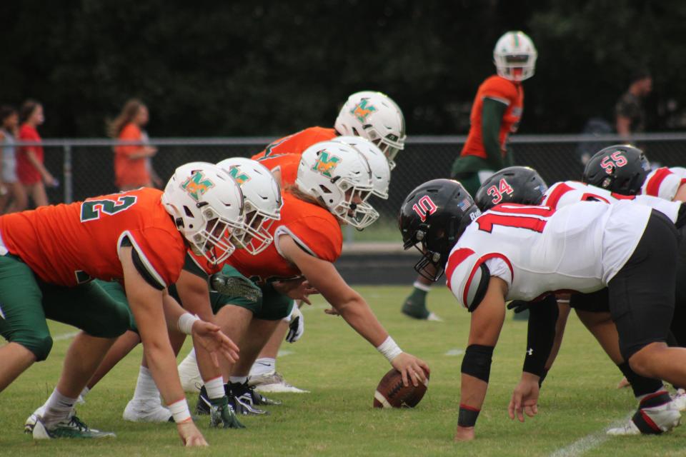 Mandarin and Creekside linemen face off across the line of scrimmage during a high school football game on September 23, 2022. [Clayton Freeman/Florida Times-Union]