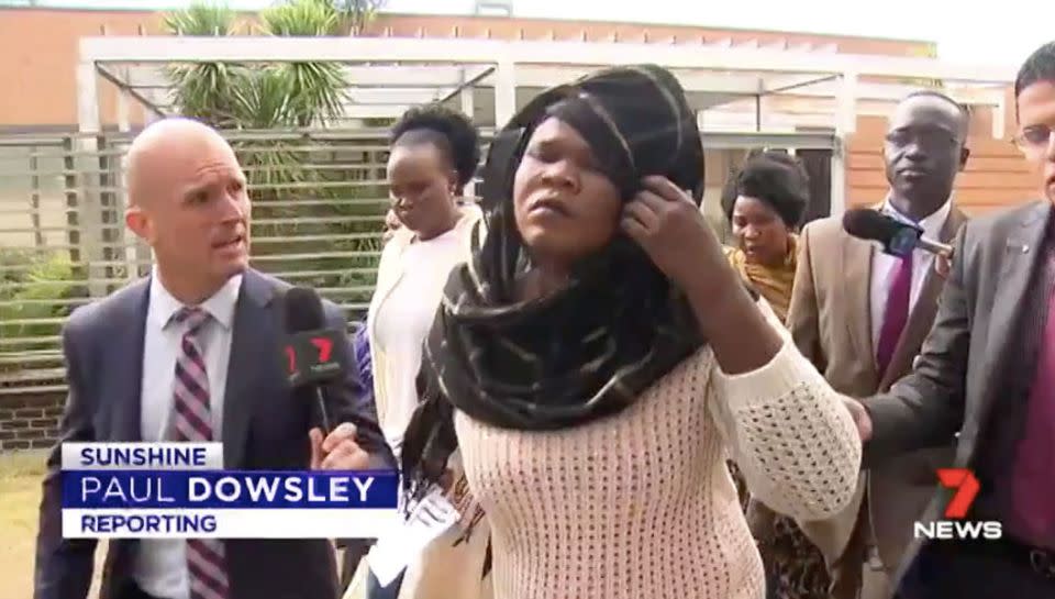 Ayou Deng leaves court flanked by supporters. Source: 7 News