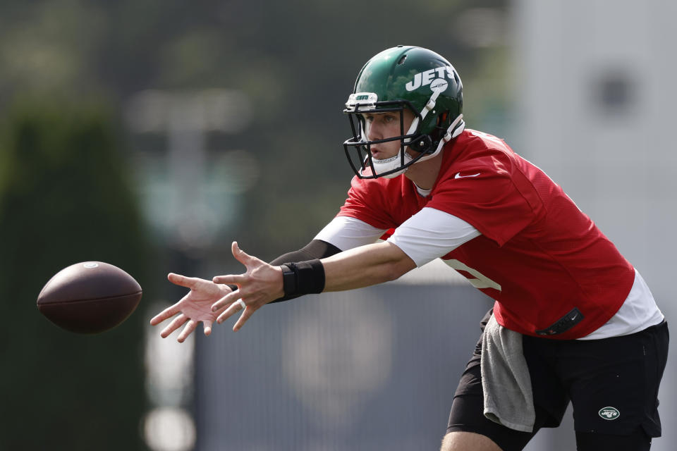 New York Jets quarterback Mike White tosses the ball during NFL football practice Wednesday, July 28, 2021, in Florham Park, N.J. (AP Photo/Adam Hunger)