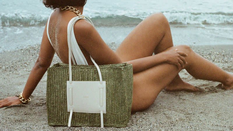 a woman sitting on a beach