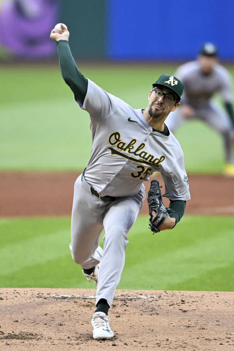 Oakland Athletics starting pitcher Joe Boyle delivers during the first inning of the team's baseball game against the Cleveland Guardians, Friday, April 19, 2024, in Cleveland. (AP Photo/Nick Cammett)