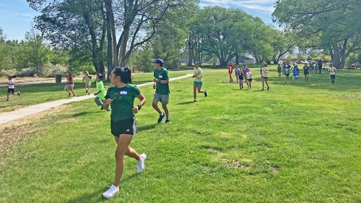 Native runners in a park