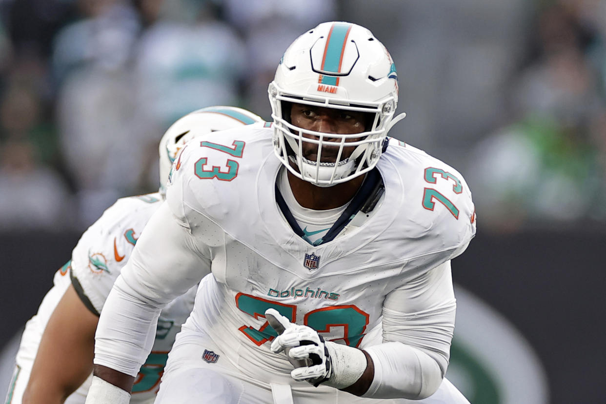 Miami Dolphins guard Austin Jackson (73) in action against the New York Jets during an NFL football game Friday, Nov. 24, 2023, in East Rutherford, N.J. The Dolphins have agreed to a three-year contract extension with Jackson, locking in the former first-round pick until 2026. (AP Photo/Adam Hunger, File)